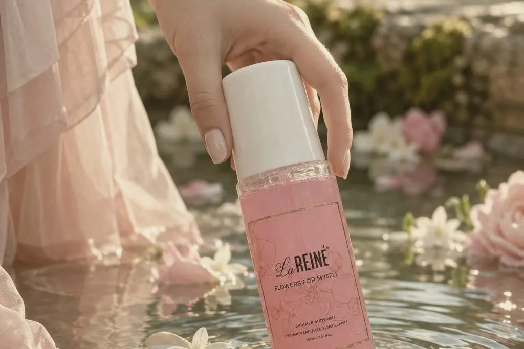 A woman sprays the Flowers for Myself mist