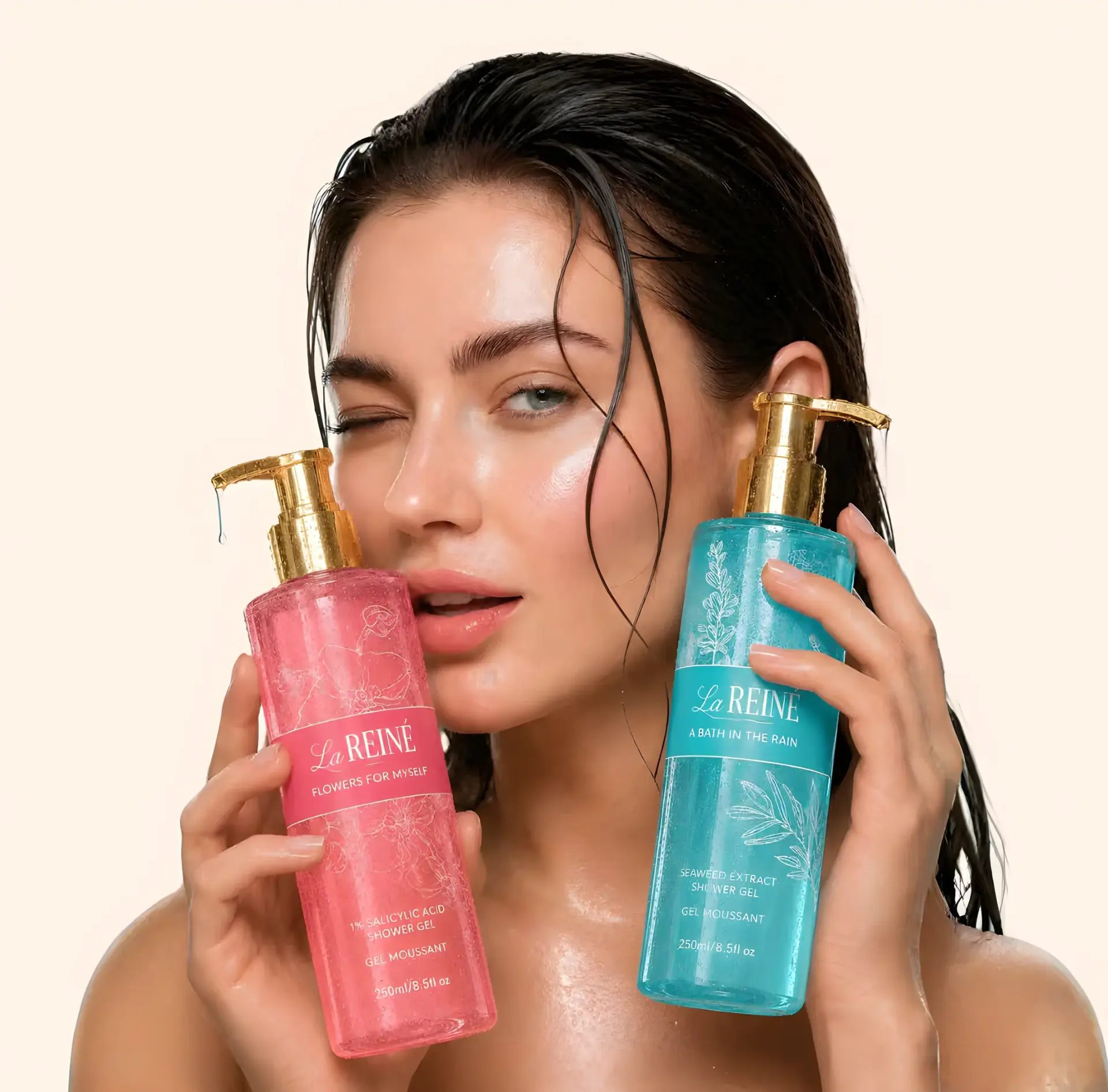 A woman with wet hair holds the Flowers for Myself and A Bath in the Rain shower gels either side of her face