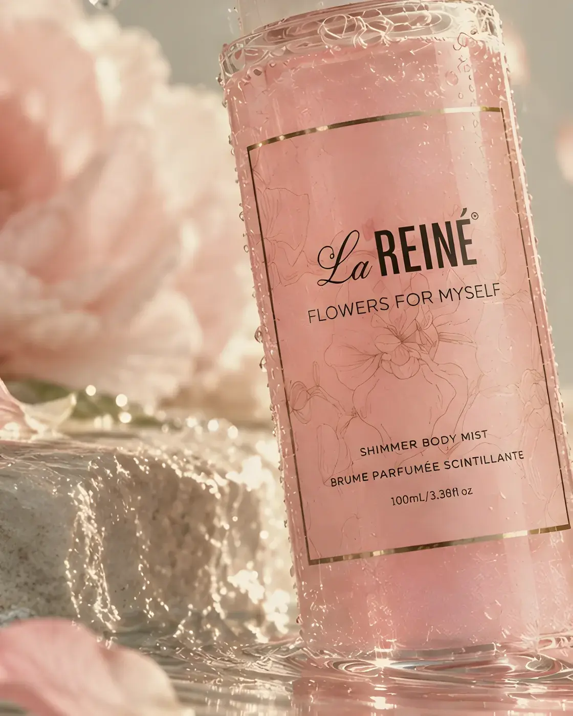 Close view of the Flowers for Myself shimmer body mist label beside a pink peony